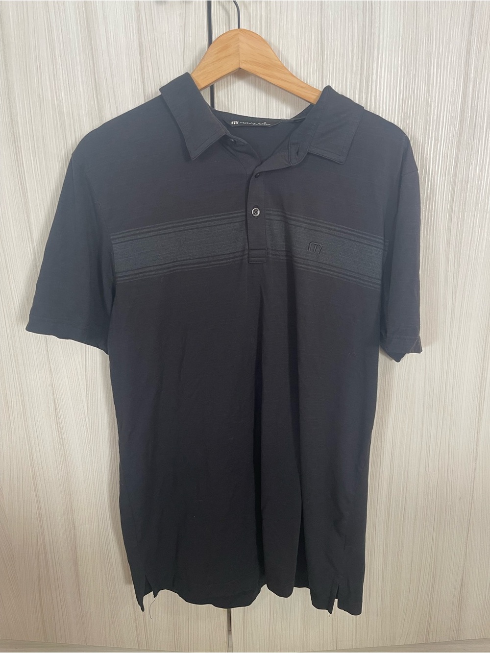 Travis Mathew Black Polo with Subtle Chest Stripe